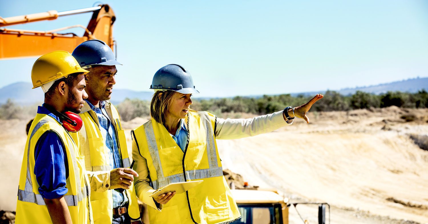Engineers outdoors site planning for hydrogen infrastructure